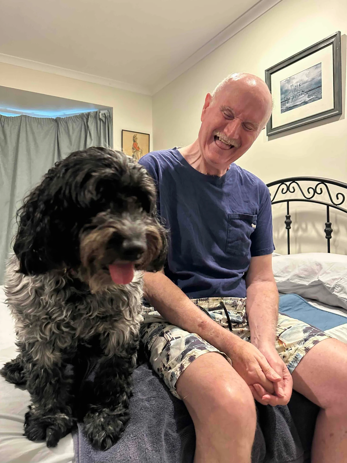 John enjoying time with his dog