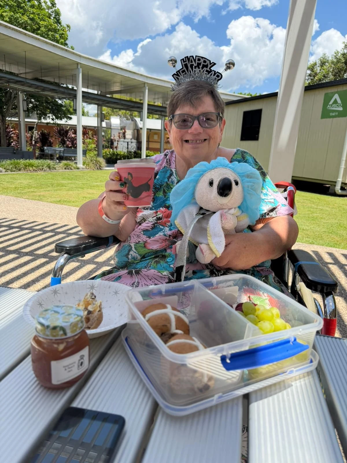 Judith enjoying time outdoors with her soft toys