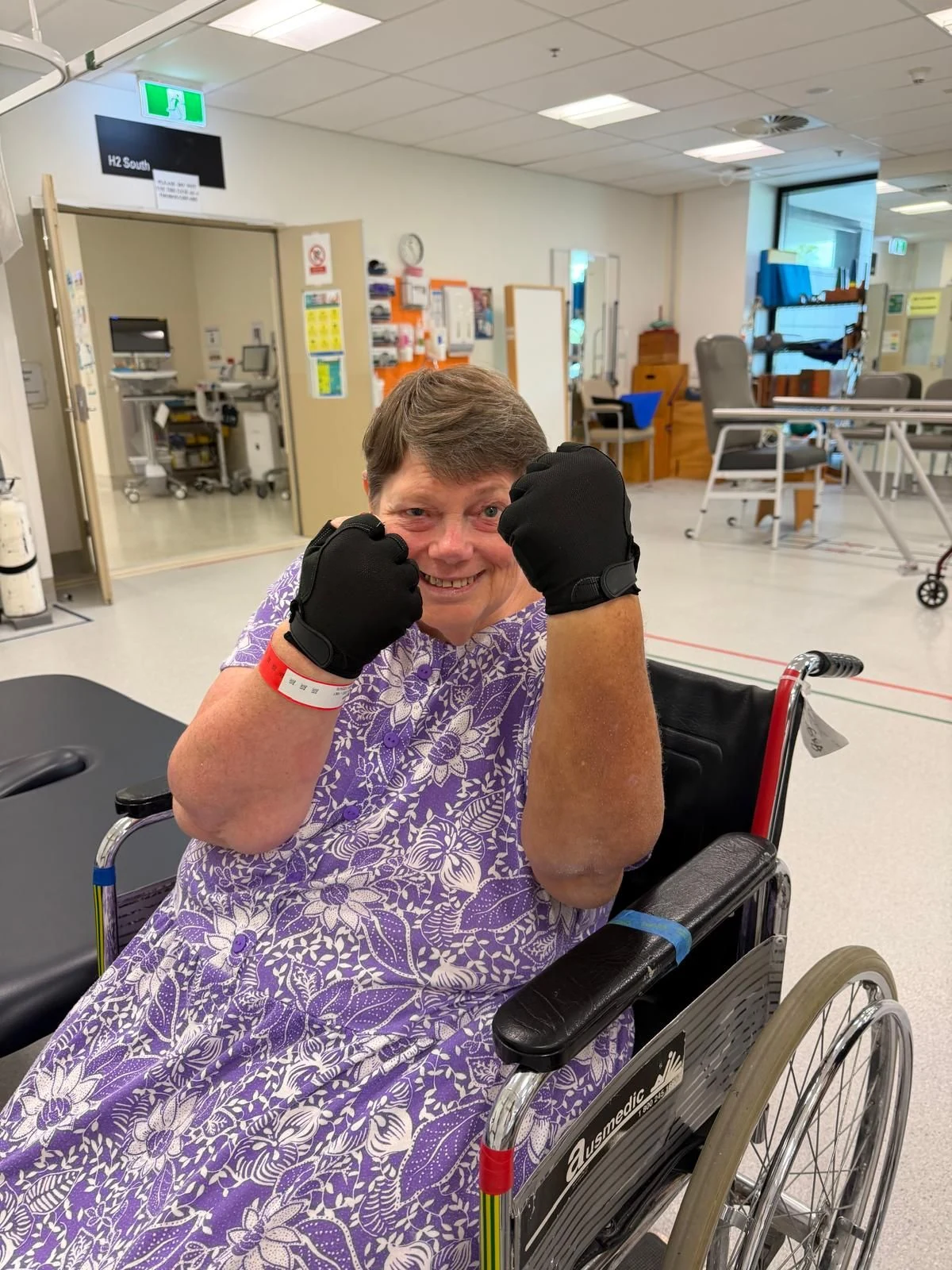 Judith smiling with her soft toys