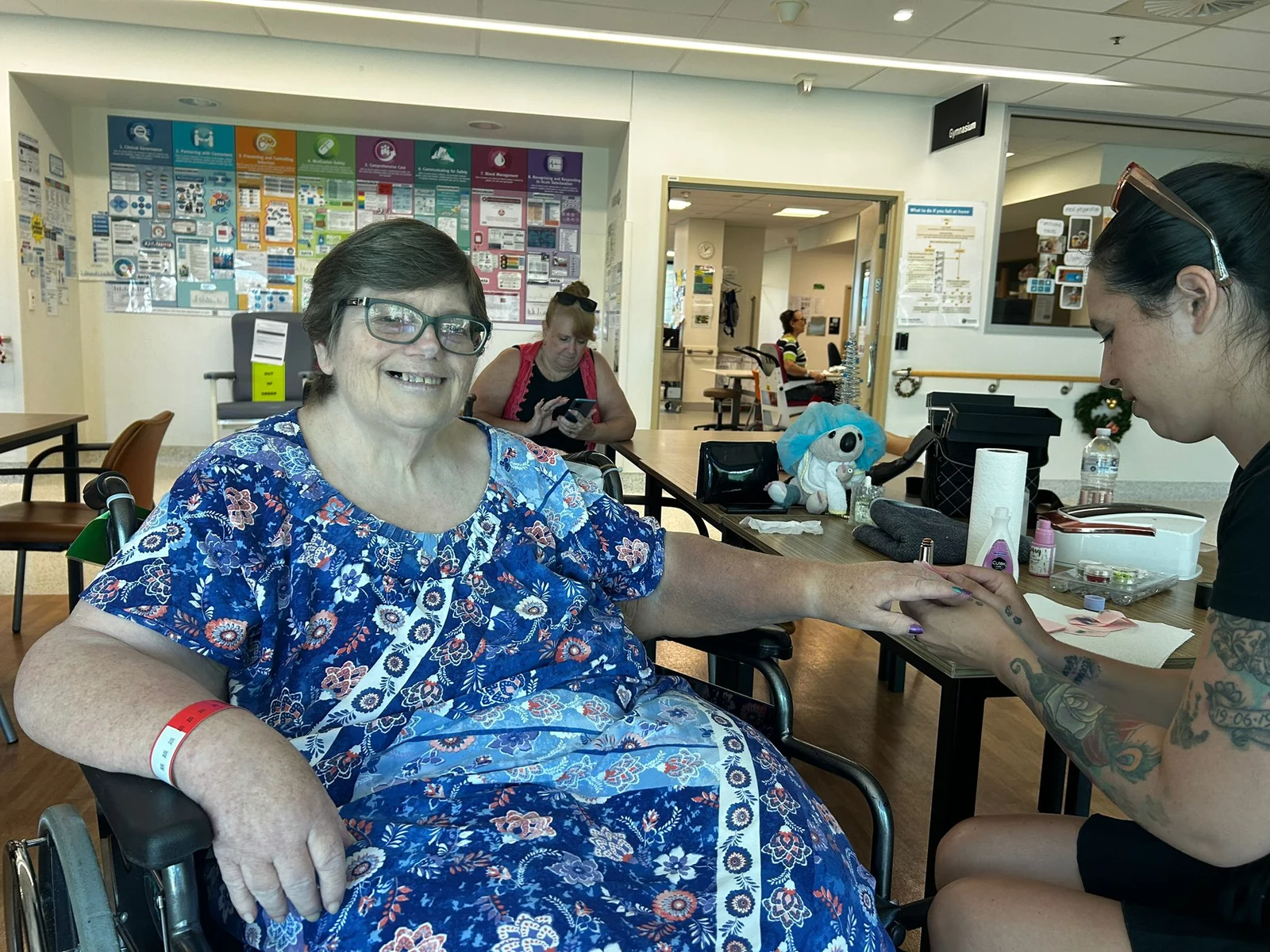 A participant sharing a moment with a support worker