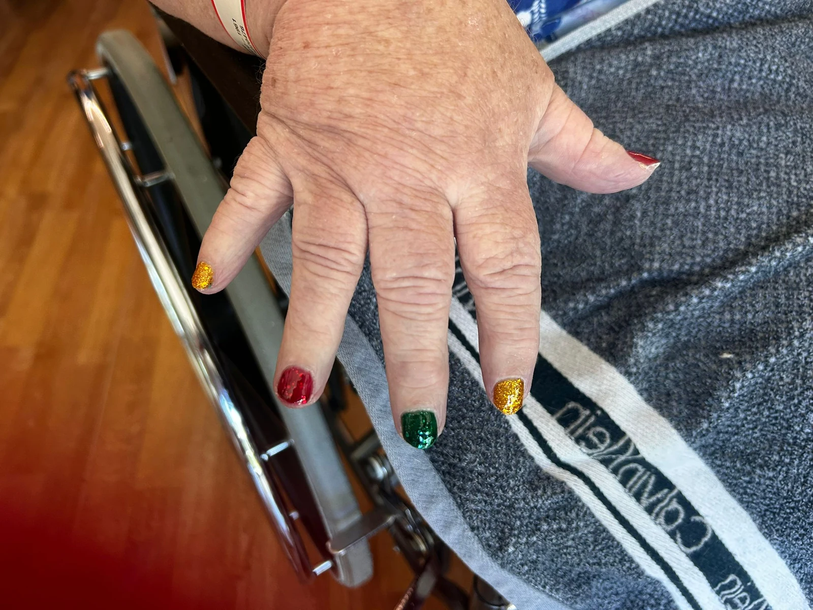 Hands showing colourful nail art