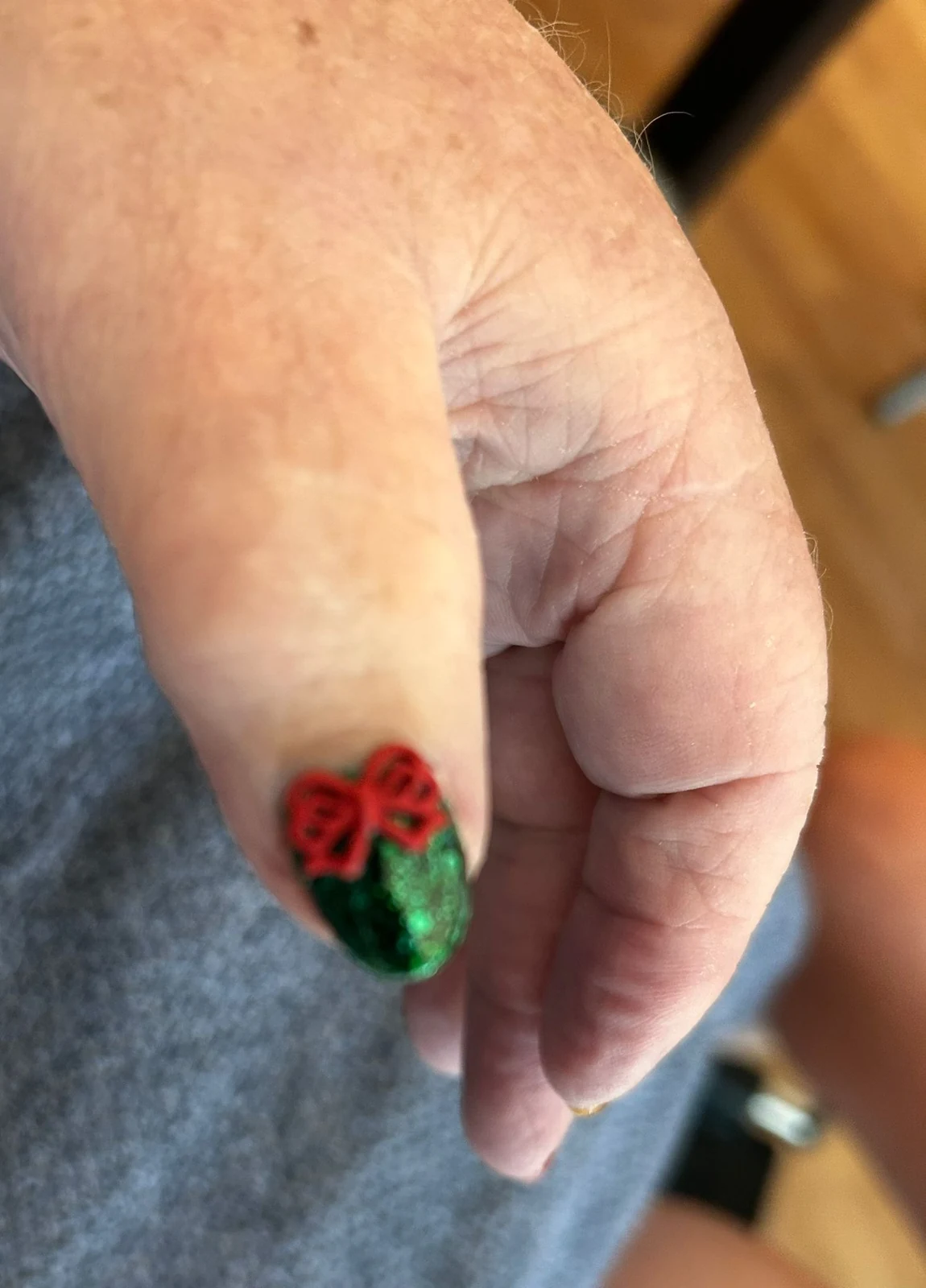 Close-up of red and green Christmas nail art