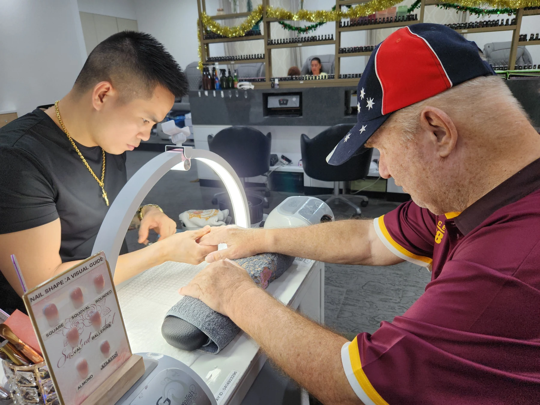 Michael enjoying a manicure with support