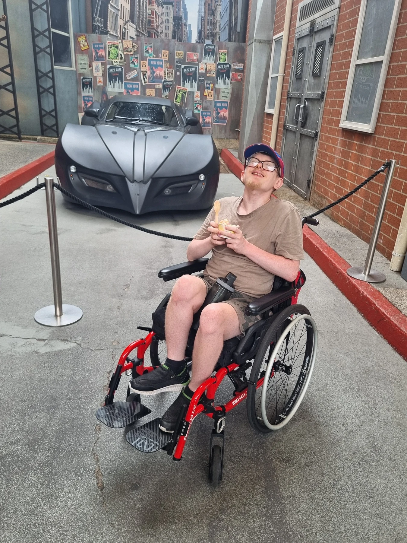 James beside the Batmobile at Movie World