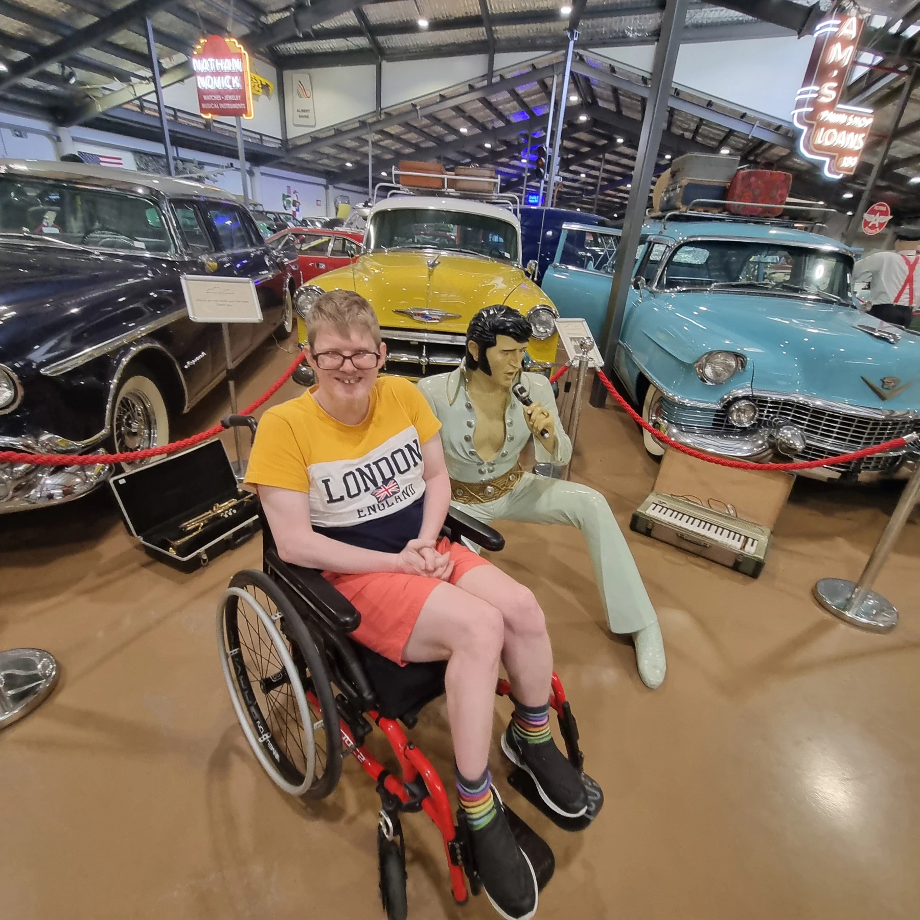James beside a vintage car at the Motor Museum